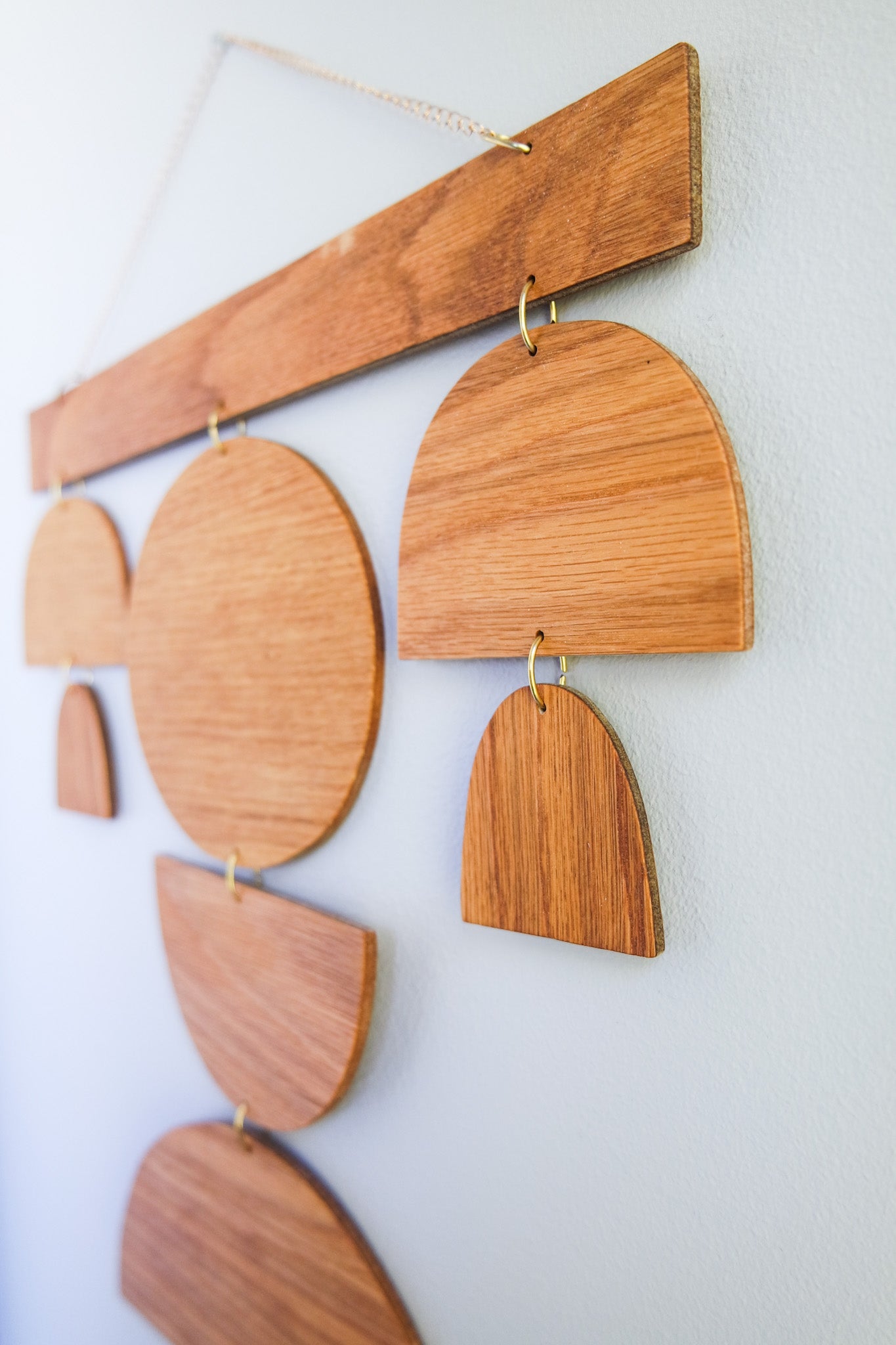 Angled view of large size wooden wall hanging made from salvaged wood. A product of Wall Echoes.